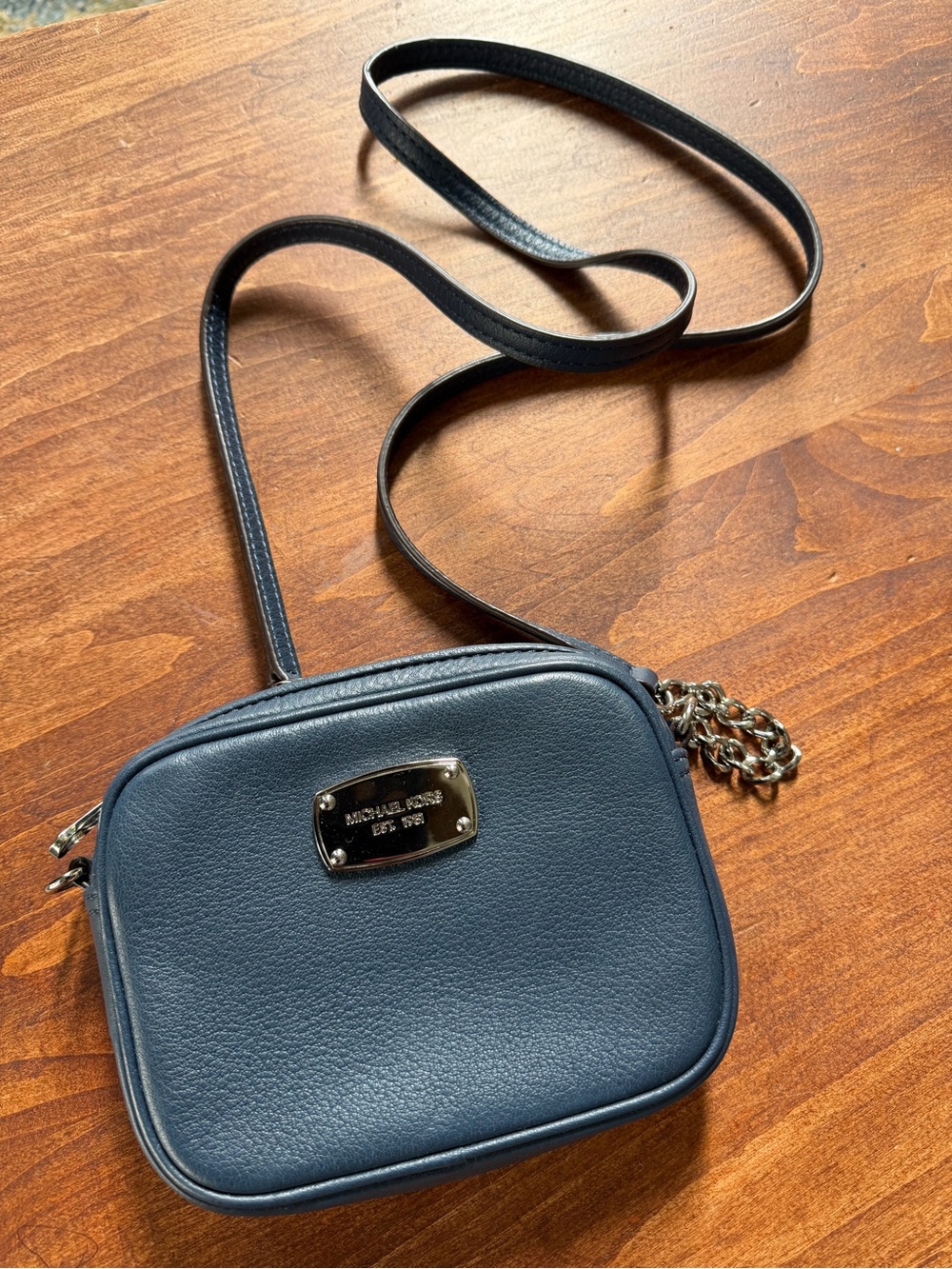 Michael Kors small leather crossbody in a navy blue color with silver hardware
